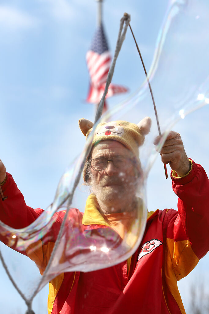 Don Jourdan waves bubble wands in the wind